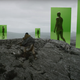 The Green Knight's Sir Gawain witnessing giants (via VFX) as he reaches the top of a rocky hill.